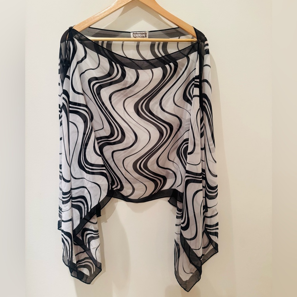 Kokomo open neck and  top/cover up. 
Very flattering. 3 black buttons each side.